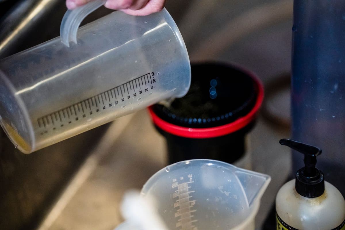 A clear measuring cup being used in a kitchen